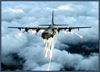AC-130 fires flares used to deflect heat-seeking missiles. Two guns protrude from the right side of the fuselage.