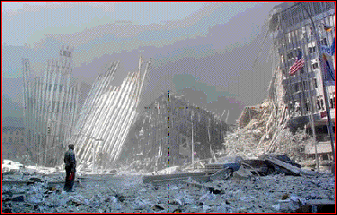 Lone man stands amist the WTC rubble.